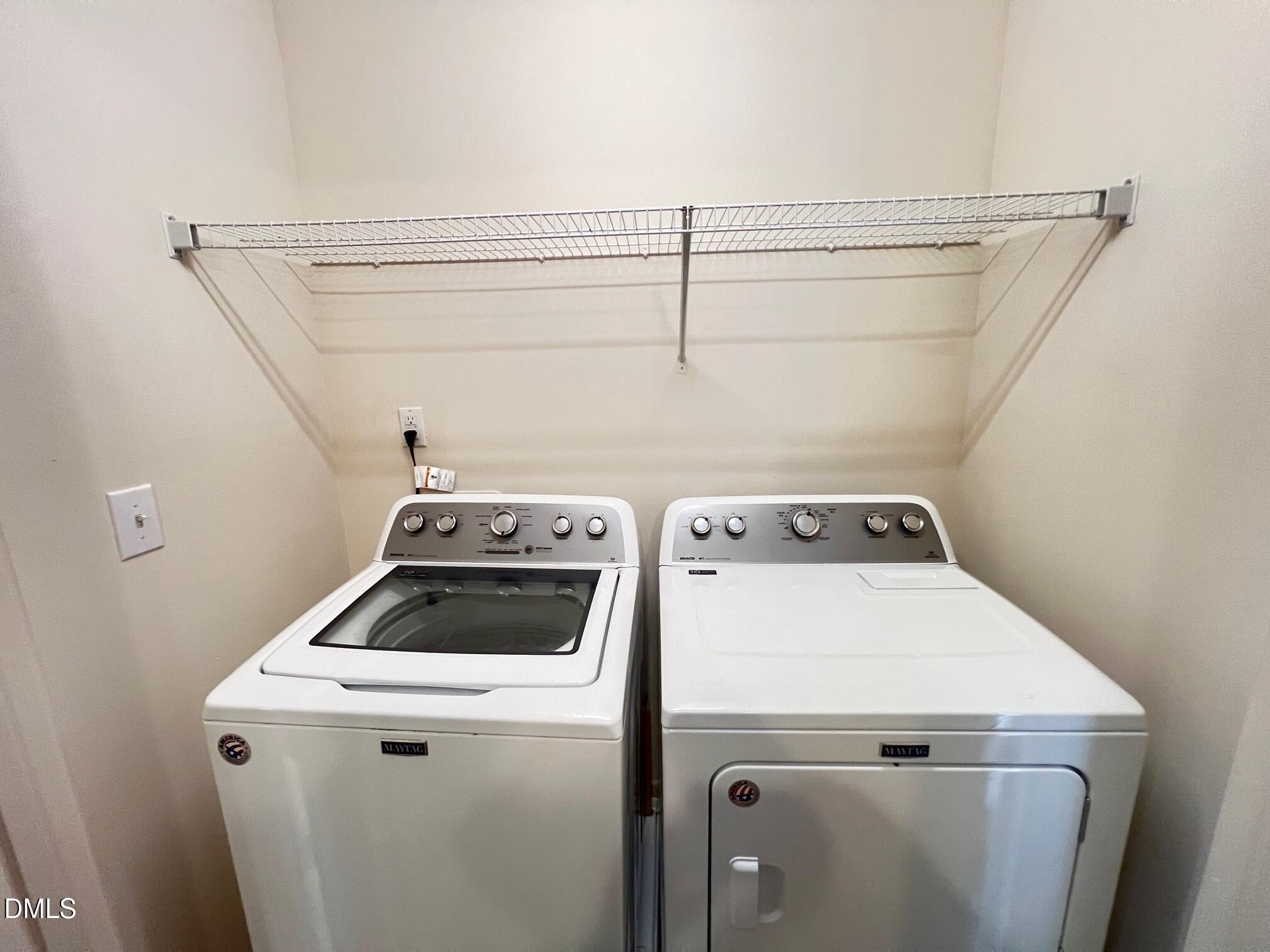 18 Rochambeau Court Durham, NC 27704 - Photo 6 of 12 a view of storage and utility room with washer and dryer