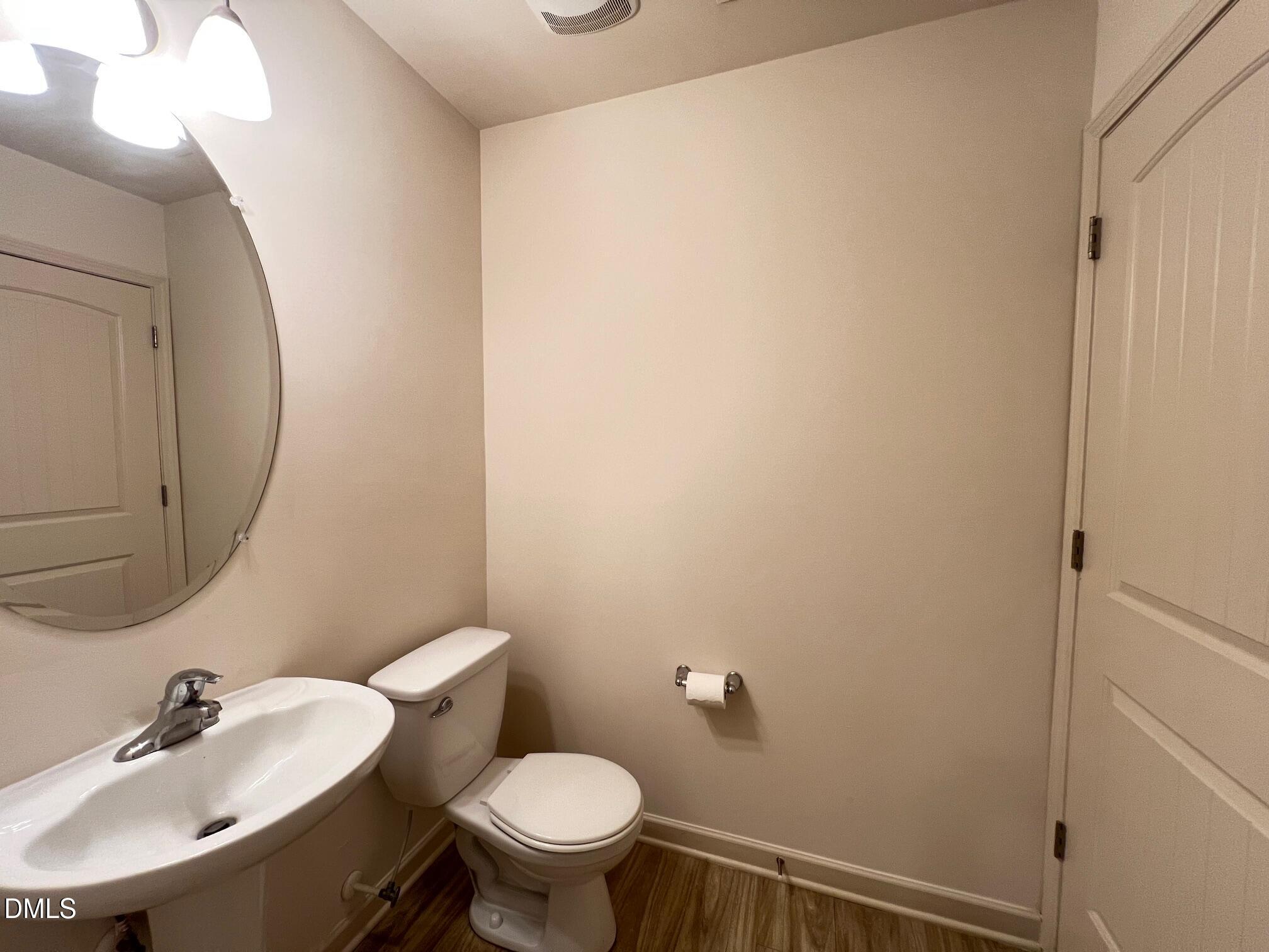 18 Rochambeau Court Durham, NC 27704 - Photo 7 of 12 a bathroom with a sink and a mirror