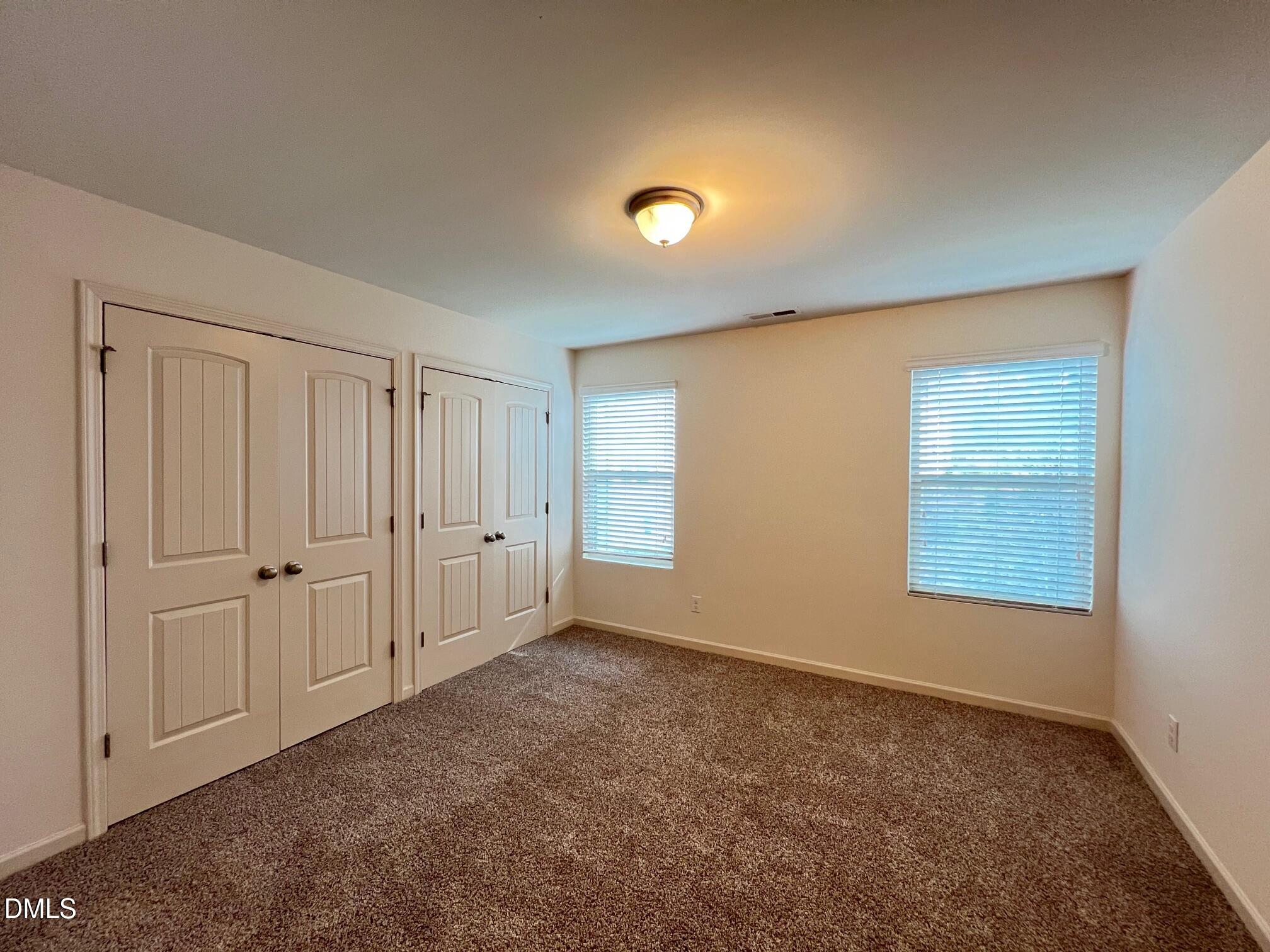 18 Rochambeau Court Durham, NC 27704 - Photo 8 of 12 a view of an empty room with a window