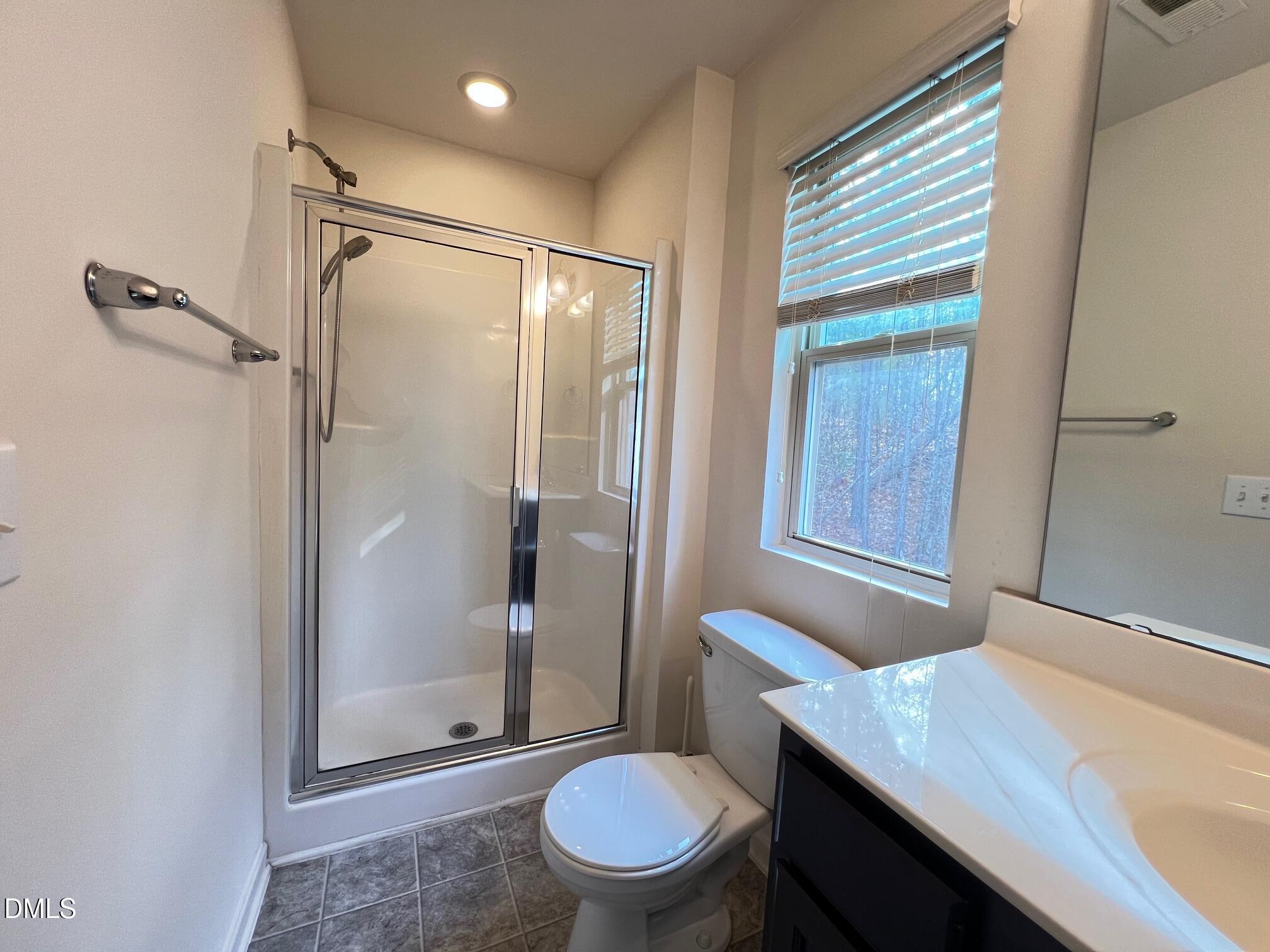 18 Rochambeau Court Durham, NC 27704 - Photo 9 of 12 a bathroom with a granite countertop sink toilet and shower