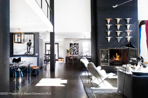 a living room with fireplace furniture and a fireplace
