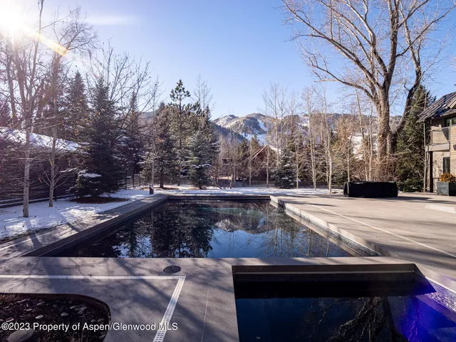 a living room with furniture a window and a fireplace
