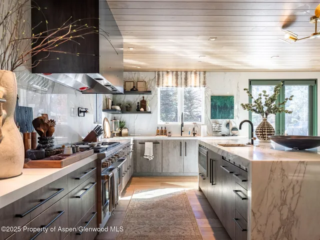 a bed room with a bed and a large window