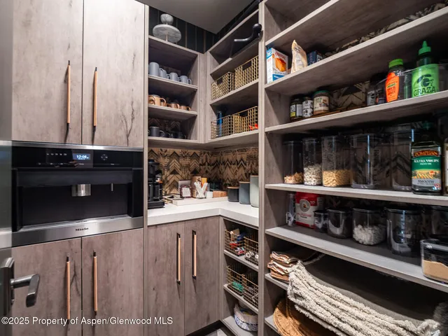 a bed room with bed and a chandelier