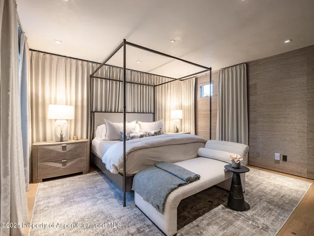 a bed room with a bed and a couch