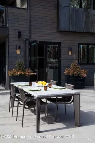 a view of a dining room with furniture wooden floor and a chandelier
