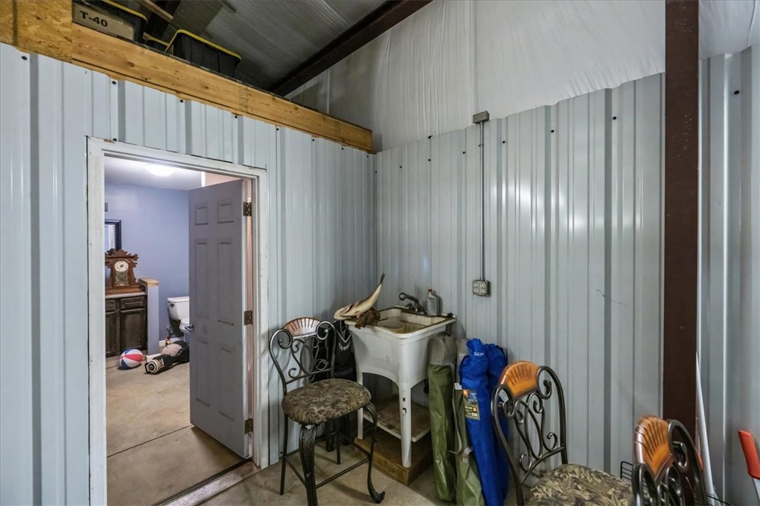 212 Winding Lane Seneca, SC 29672 - Photo 44 of 47 This versatile workshop space offers practical amenities for various tasks and projects.