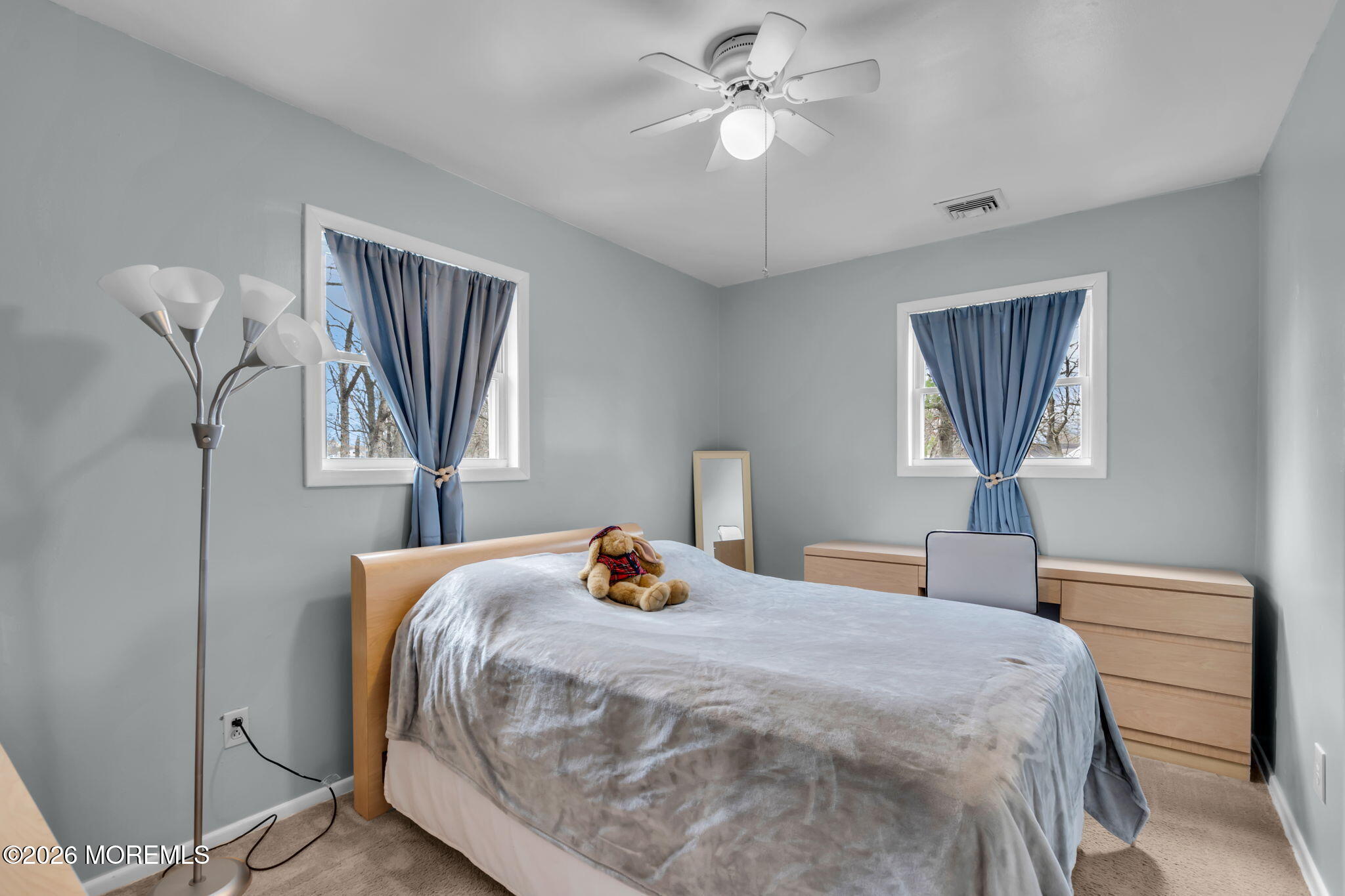 26 Clark Drive Howell, NJ 07731 - Photo 14 of 25 a bedroom with a bed and a chandelier