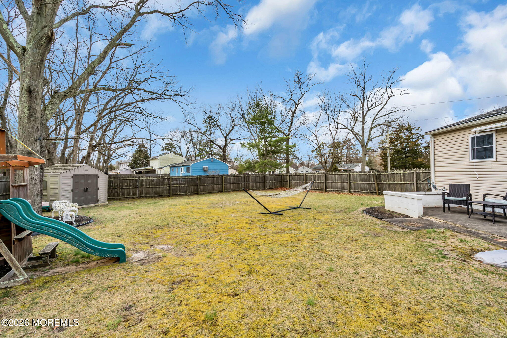26 Clark Drive Howell, NJ 07731 - Photo 25 of 25 a view of a swimming pool with a bench
