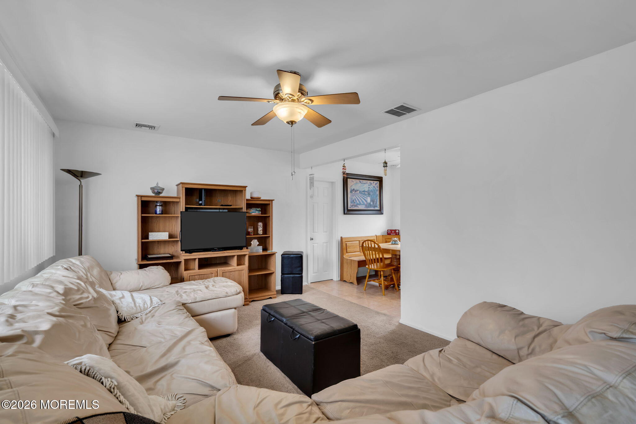 26 Clark Drive Howell, NJ 07731 - Photo 4 of 25 a living room with furniture and a flat screen tv