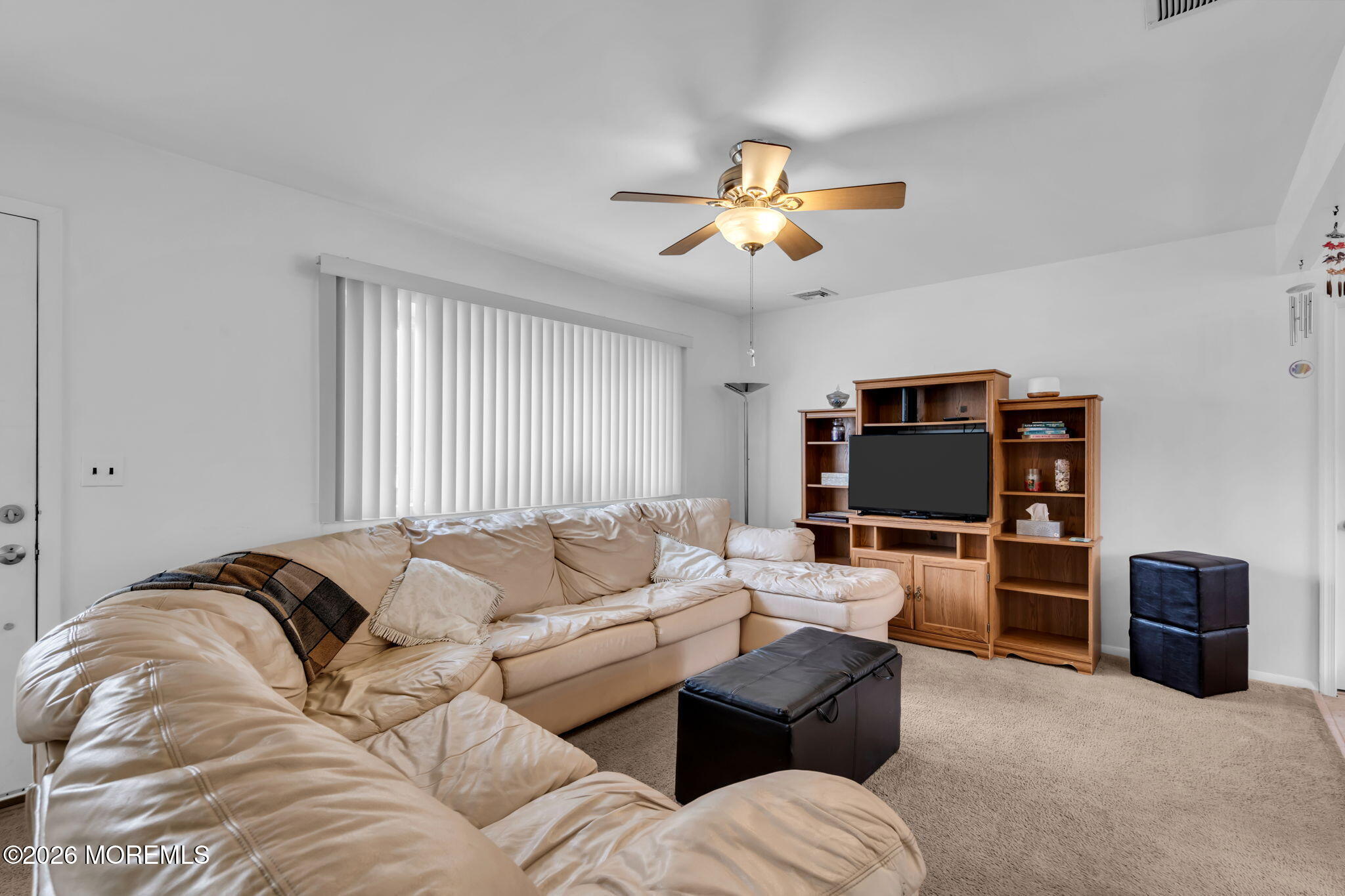 26 Clark Drive Howell, NJ 07731 - Photo 5 of 25 a living room with furniture and a flat screen tv