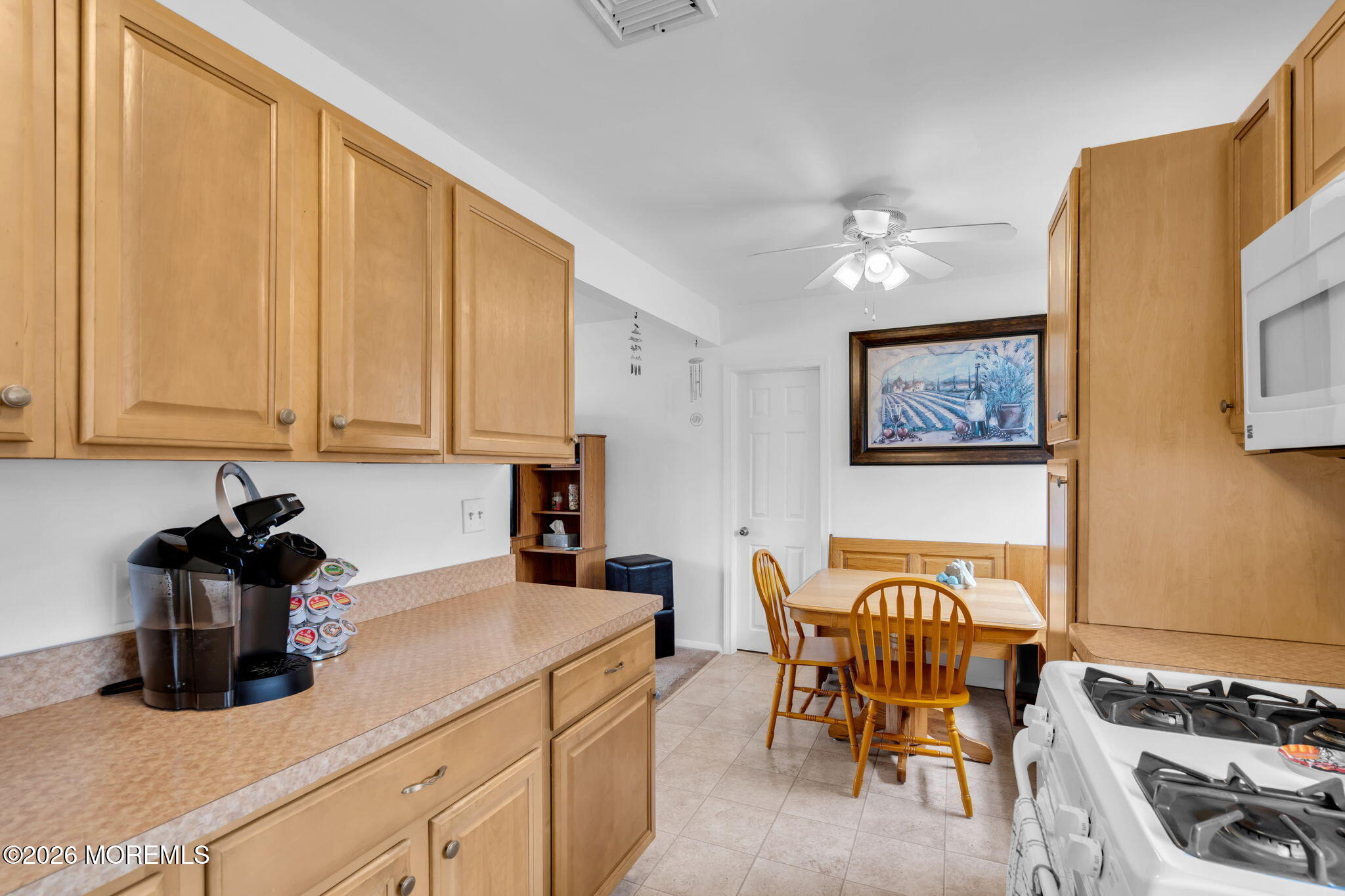 26 Clark Drive Howell, NJ 07731 - Photo 9 of 25 a kitchen with stainless steel appliances granite countertop sink stove top oven and cabinets