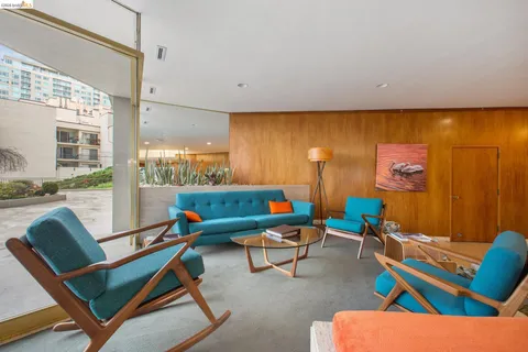 a very nice looking living room with a large window