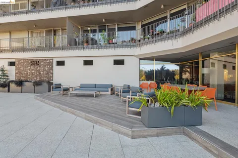 a outdoor dining space with furniture and garden view