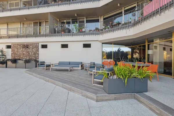 a outdoor dining space with furniture and garden view