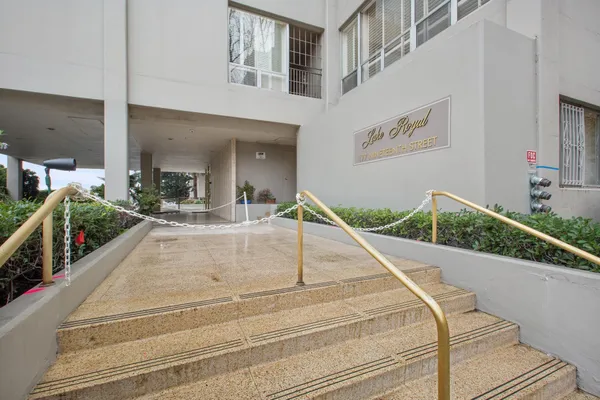a view of a living room and entry gate