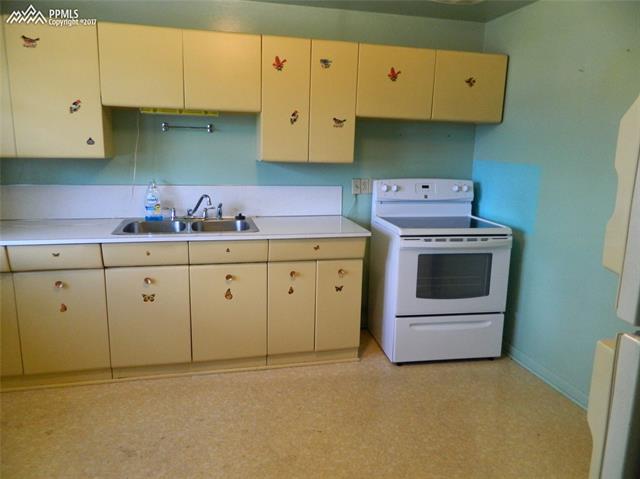 1928 Winston Road Colorado Springs, CO 80909 - Photo 5 of 16 Metal cabinets - love the retro look. Newer range/oven.