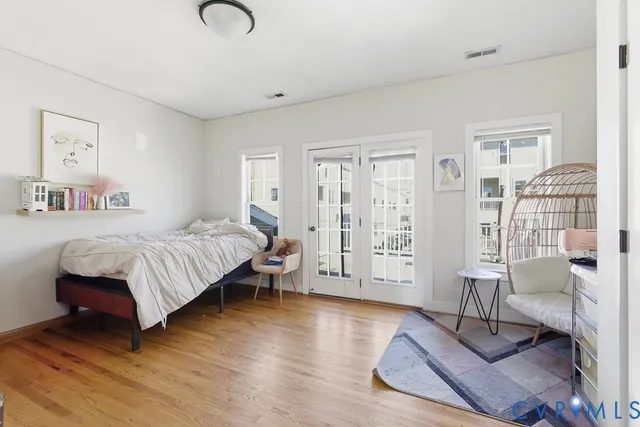 a bedroom with a bed couch and a table