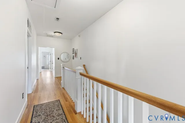 a view of a hallway with a dining room