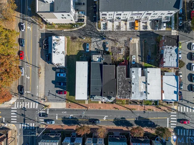 a city street filled with lots of traffic and tall buildings