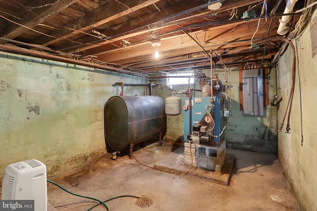 a room with water heater and storage