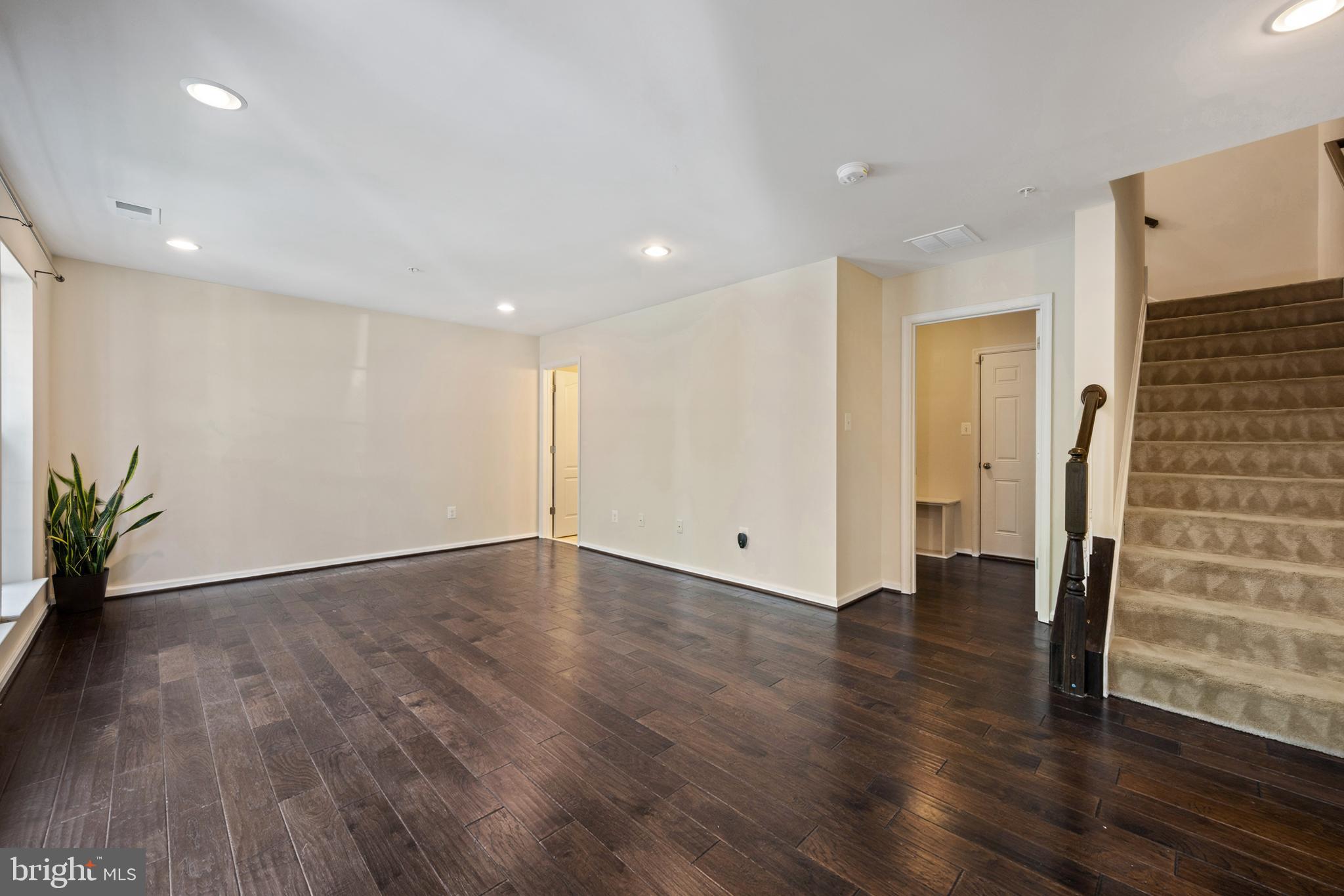 7062 Foxton Way Hanover, MD 21076 - Photo 7 of 41 an empty room with wooden floor and windows