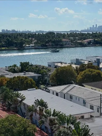 an aerial view of a house with a lake view