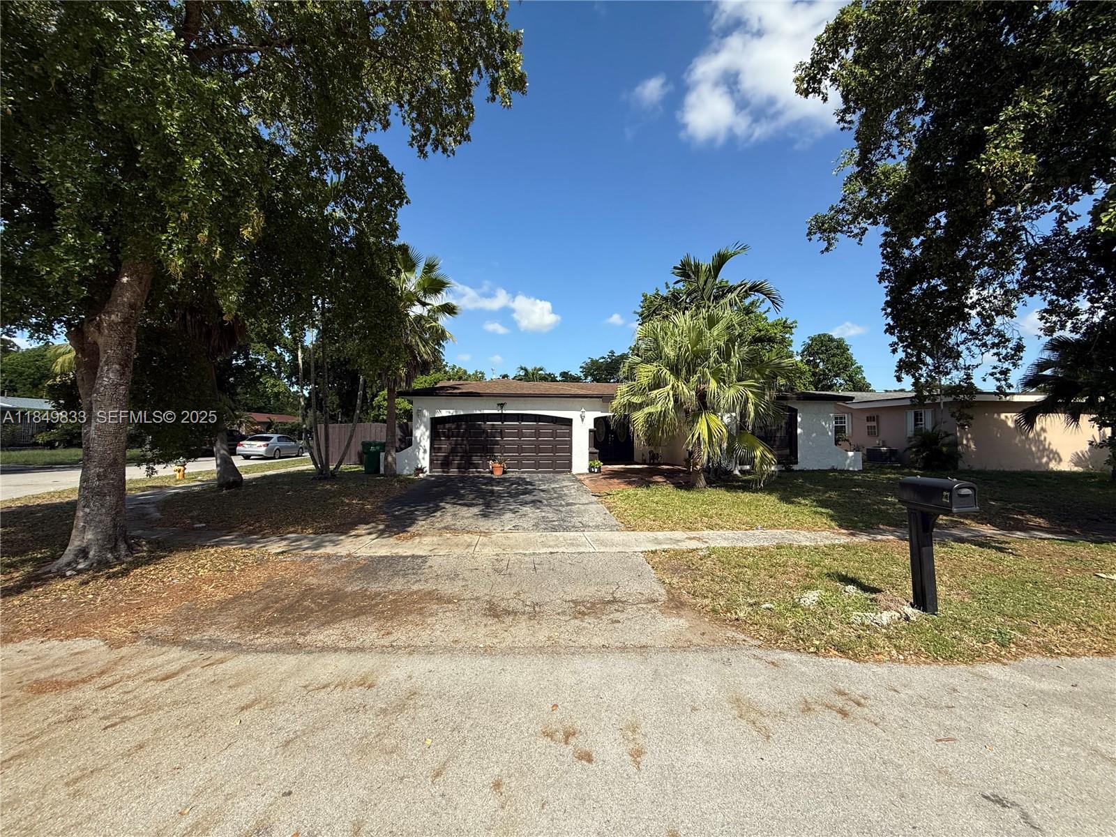 a view of a yard with a tree