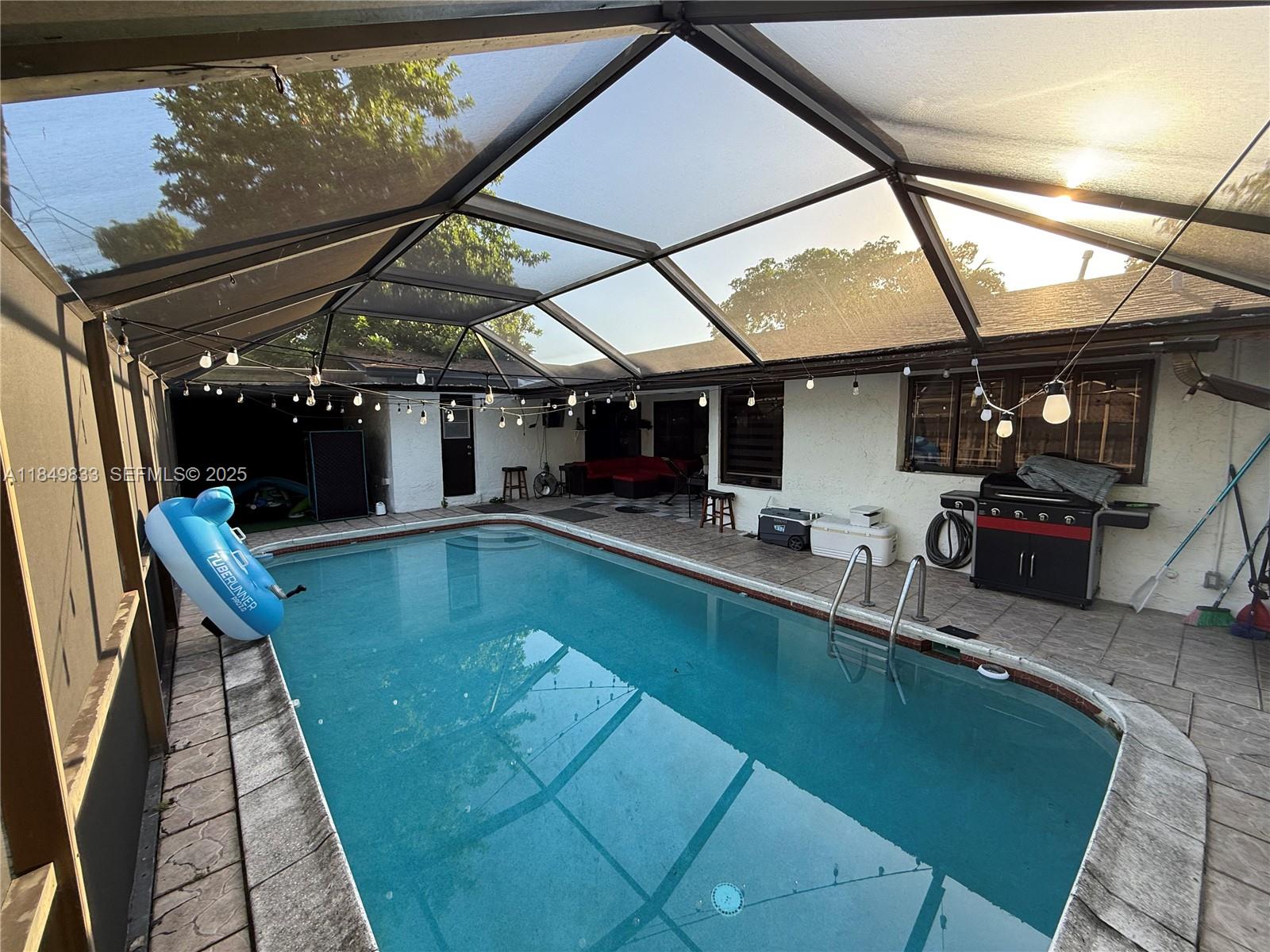 3404 Onyx Road Miramar, FL 33025 - Photo 3 of 6 an outdoor space with swimming pool and furniture