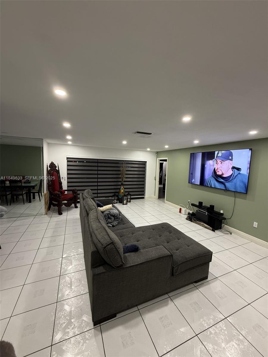 3404 Onyx Road Miramar, FL 33025 - Photo 4 of 6 a lobby with furniture and a flat screen tv