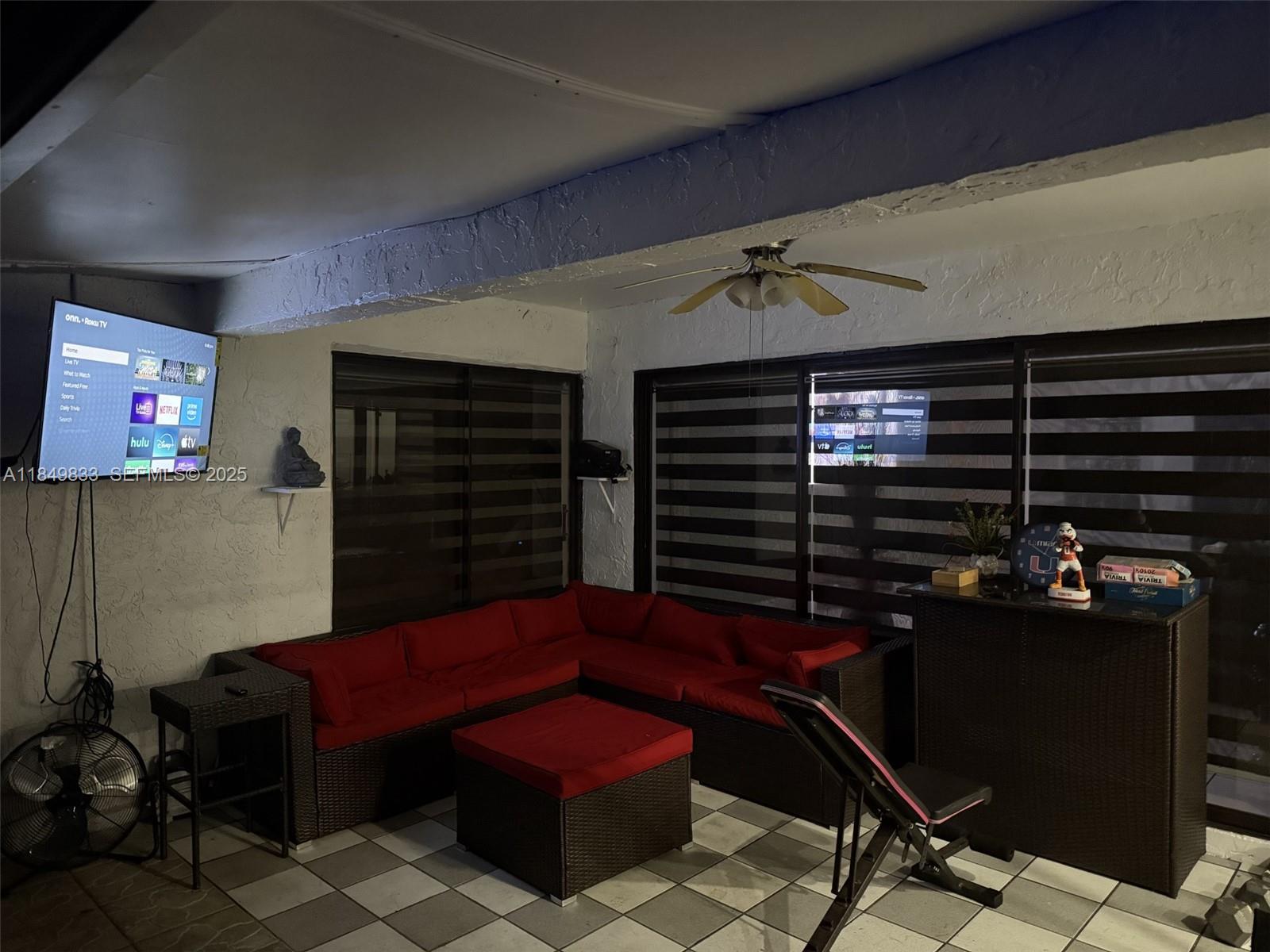 3404 Onyx Road Miramar, FL 33025 - Photo 5 of 6 a livingroom with furniture and a flat screen tv