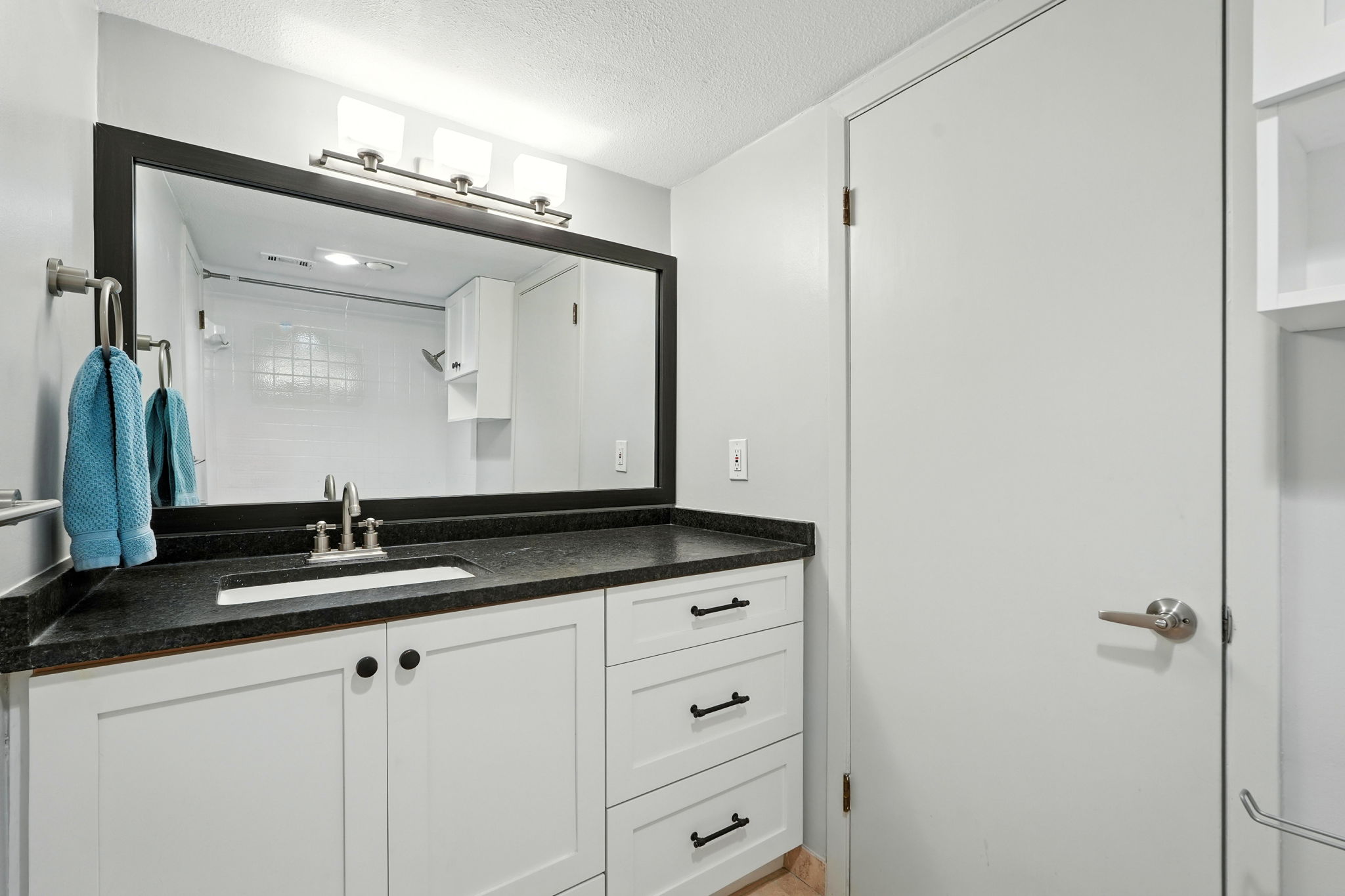 2918 Ranch Road 620 North, Unit C115 Austin, TX 78734 - Photo 18 of 39 Bathroom with vanity and a textured ceiling