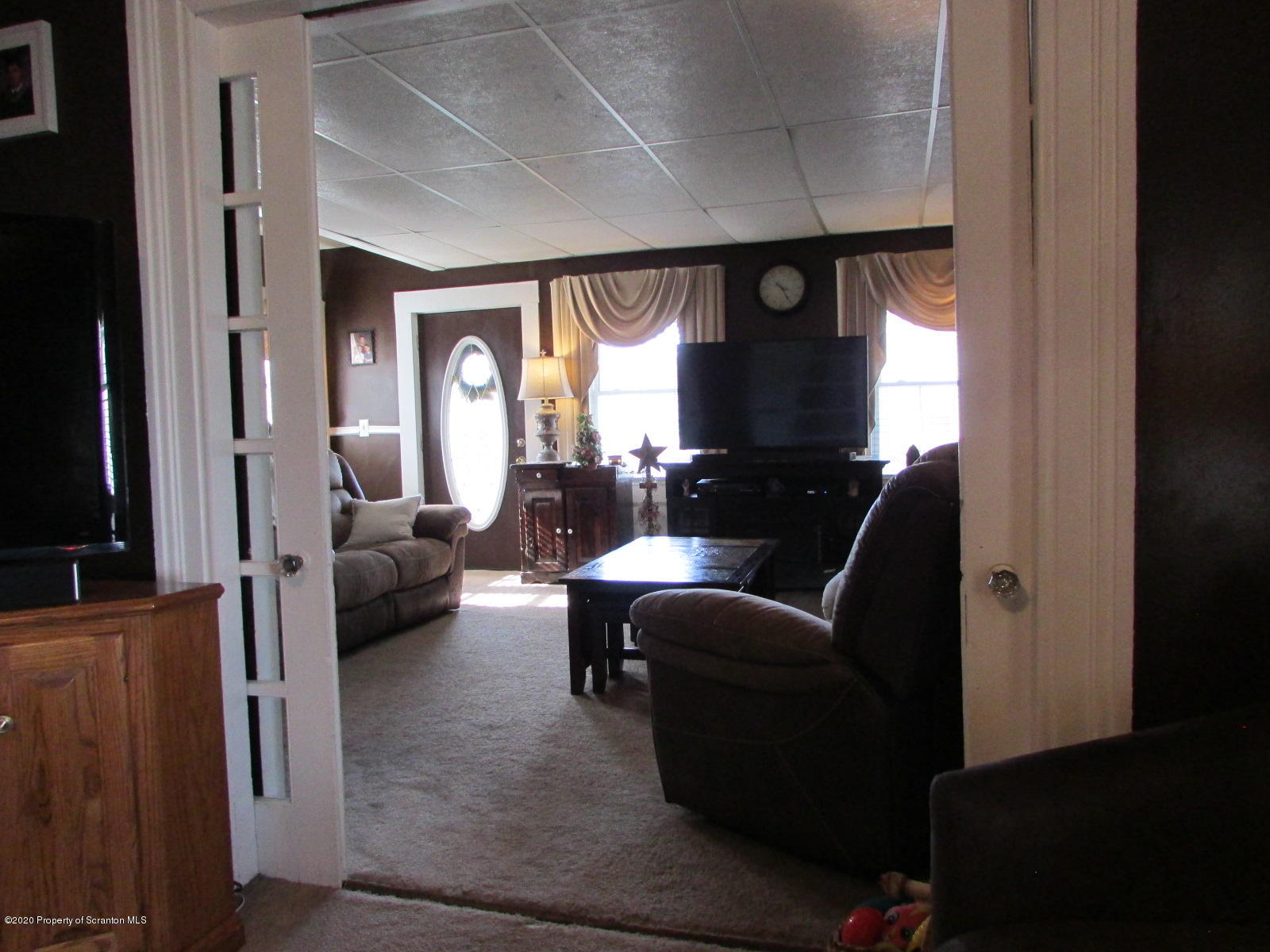520 Main Street Great Bend, PA 18821 - Photo 14 of 34 a living room with furniture and a large window