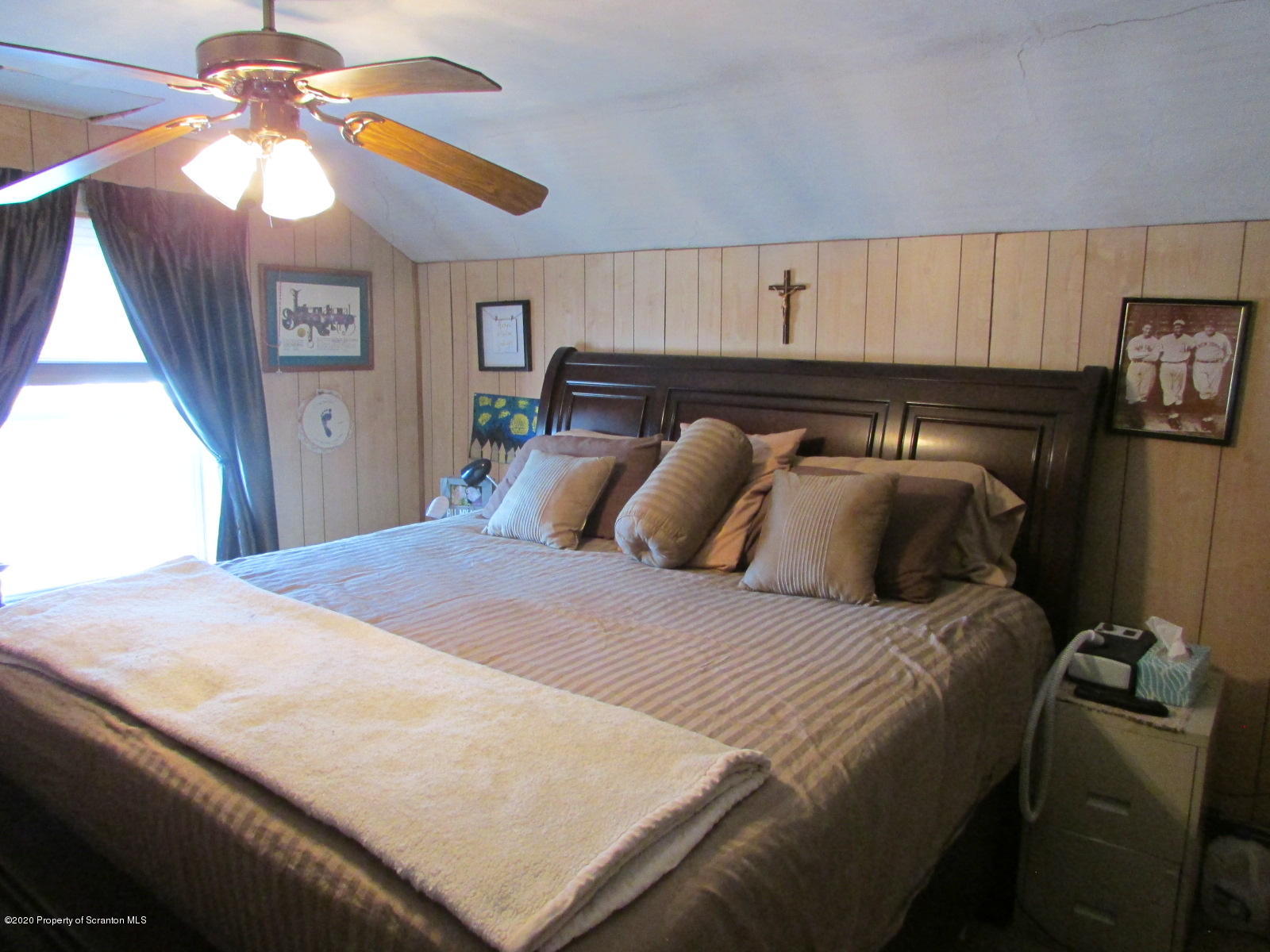 520 Main Street Great Bend, PA 18821 - Photo 22 of 34 a bedroom with a bed and a ceiling fan