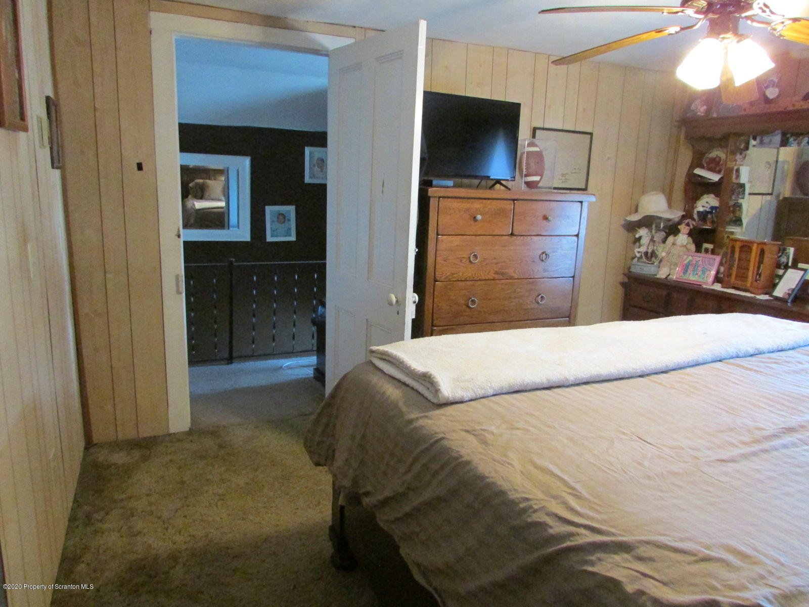 520 Main Street Great Bend, PA 18821 - Photo 23 of 34 a bedroom with a bed and flat screen tv