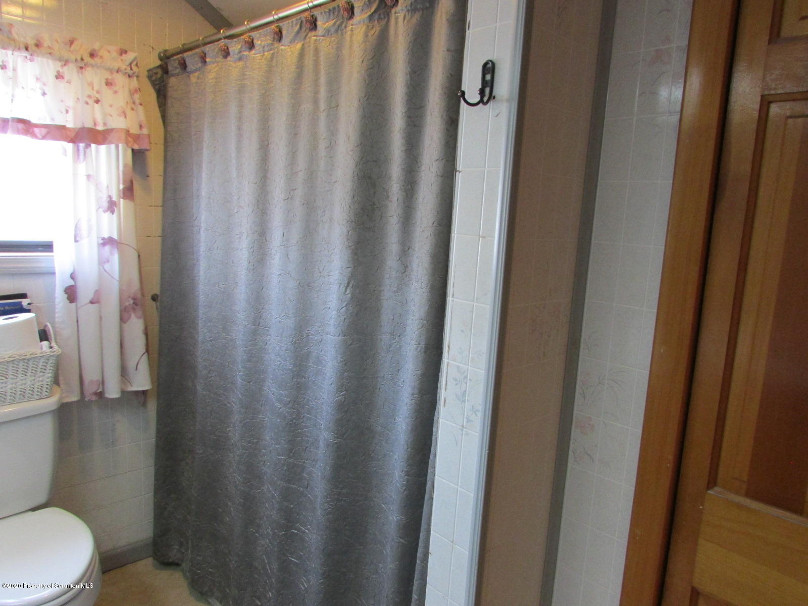 520 Main Street Great Bend, PA 18821 - Photo 29 of 34 a bathroom with a shower curtain and sink