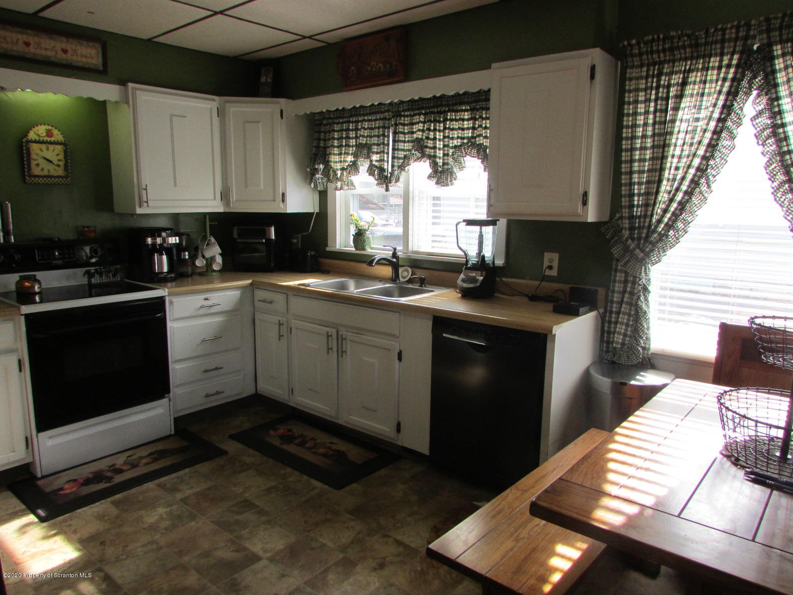 520 Main Street Great Bend, PA 18821 - Photo 4 of 34 a kitchen with a sink stove and cabinets