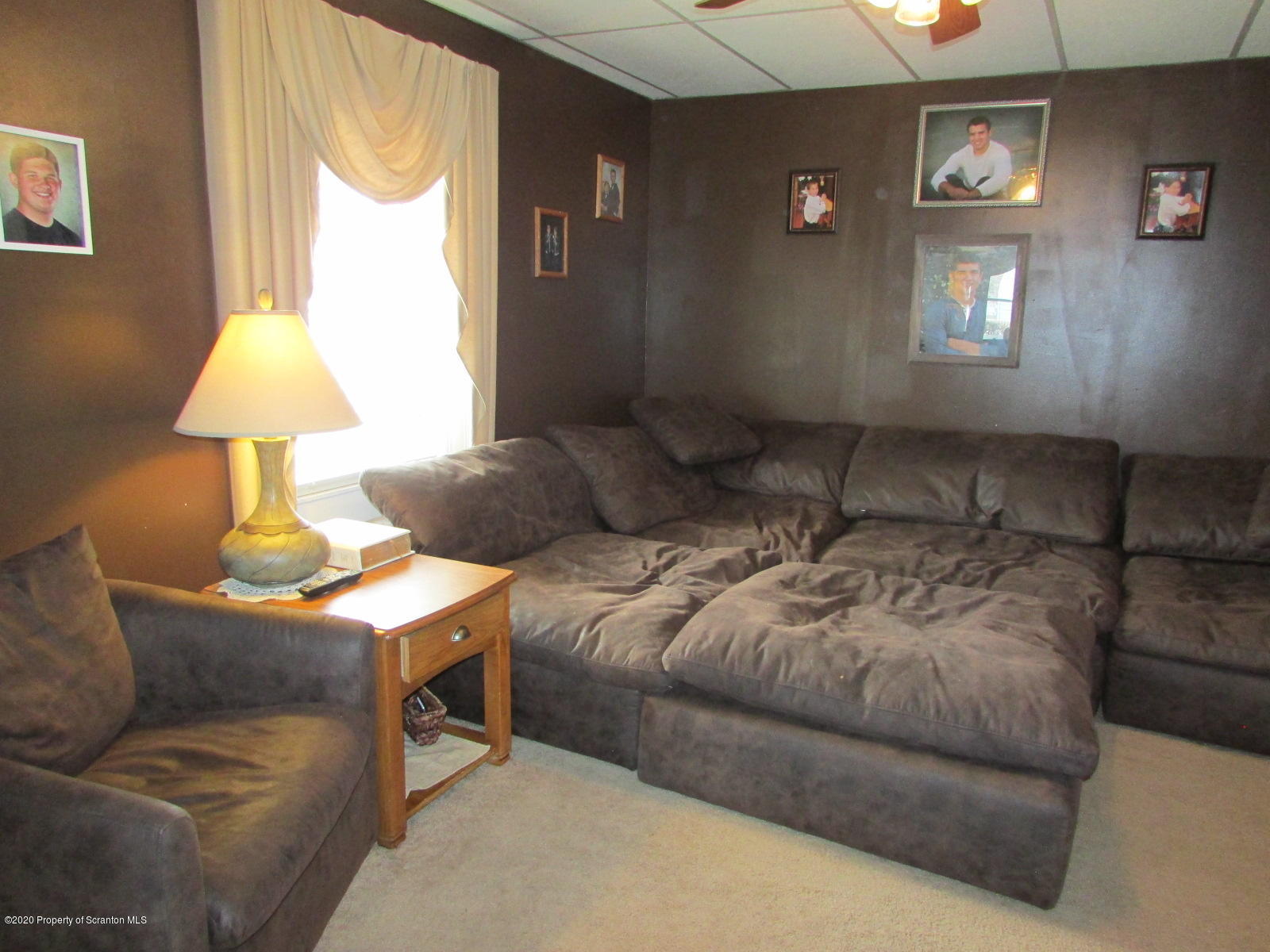 520 Main Street Great Bend, PA 18821 - Photo 10 of 34 a bedroom with a bed and a lamp