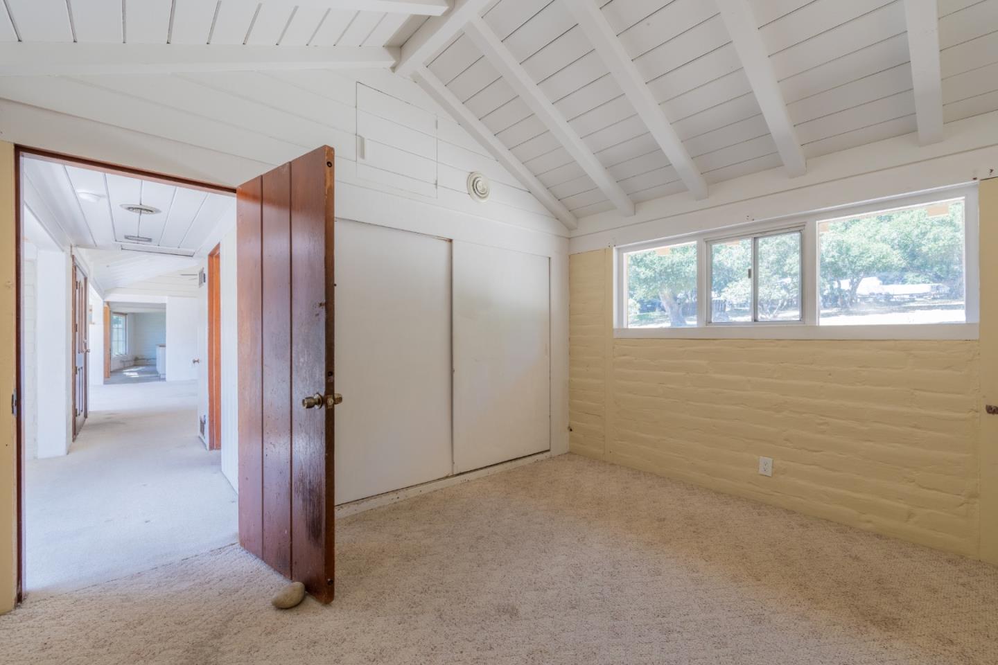 72 Los Laureles Grade Road Carmel Valley, CA 93924 - Photo 19 of 43 a view of an empty room with a window