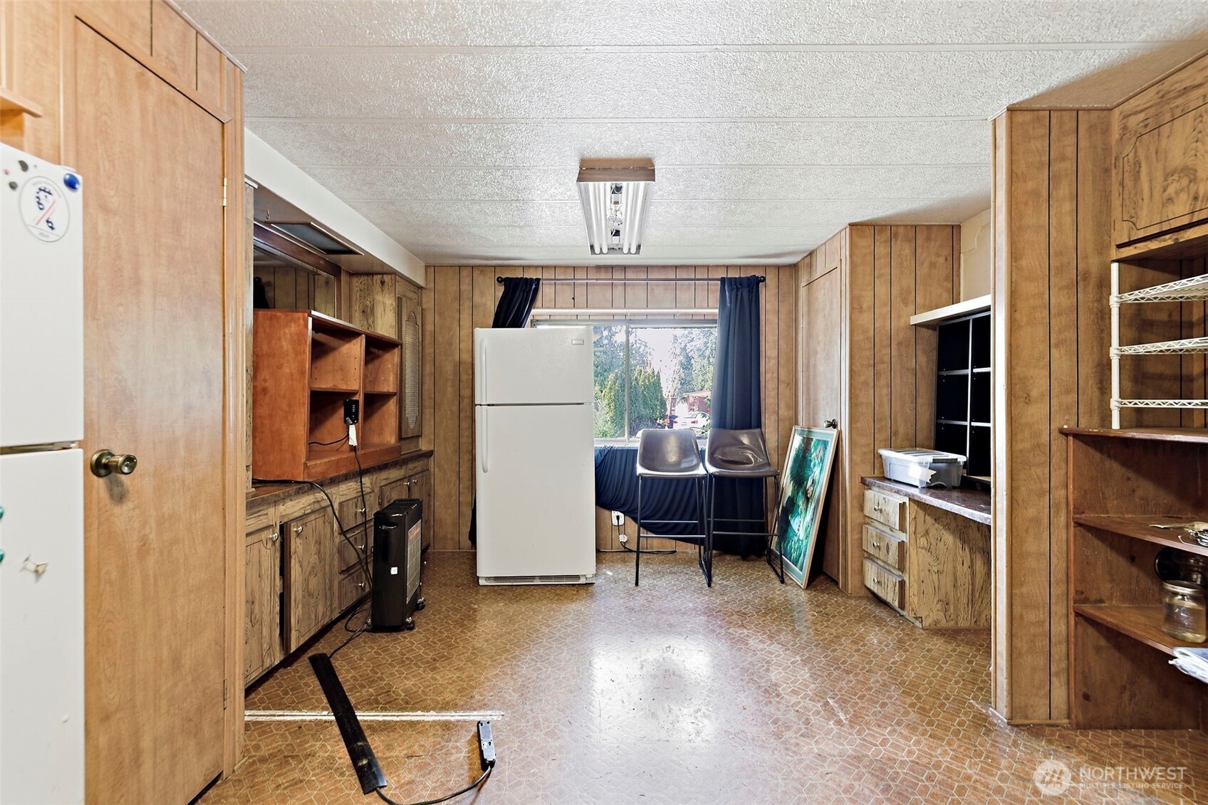 3333 228th Street Southeast, Unit 99 Bothell, WA 98021 - Photo 12 of 27 a view of kitchen with furniture stove and refrigerator