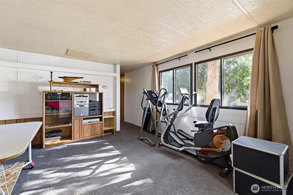 a view of a room with racks and window