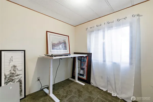 a bathroom with a granite countertop sink a mirror and a window
