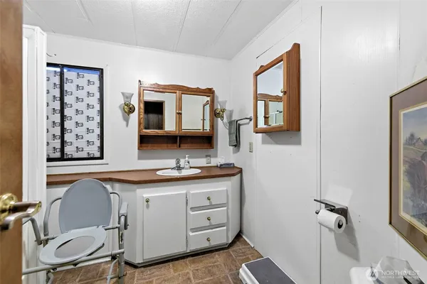 a bedroom with a bed and a table