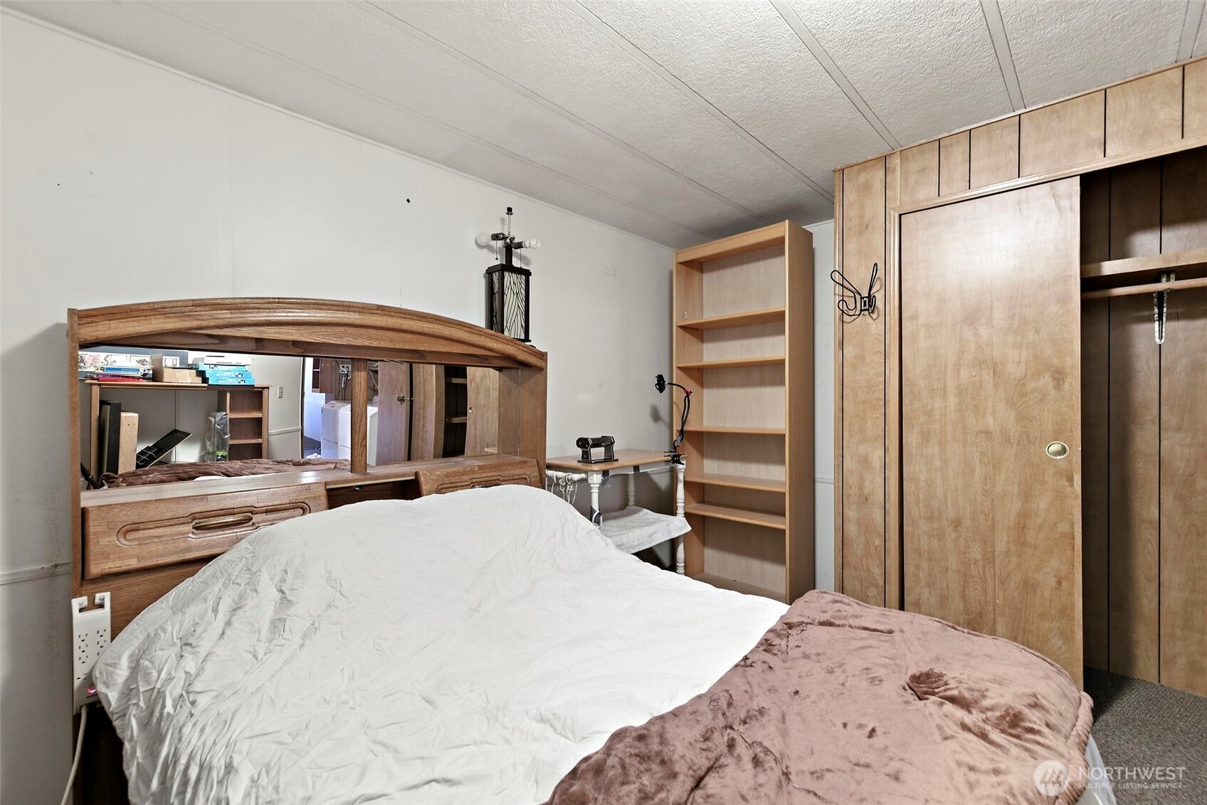 3333 228th Street Southeast, Unit 99 Bothell, WA 98021 - Photo 19 of 27 a bedroom with a bed and a large window