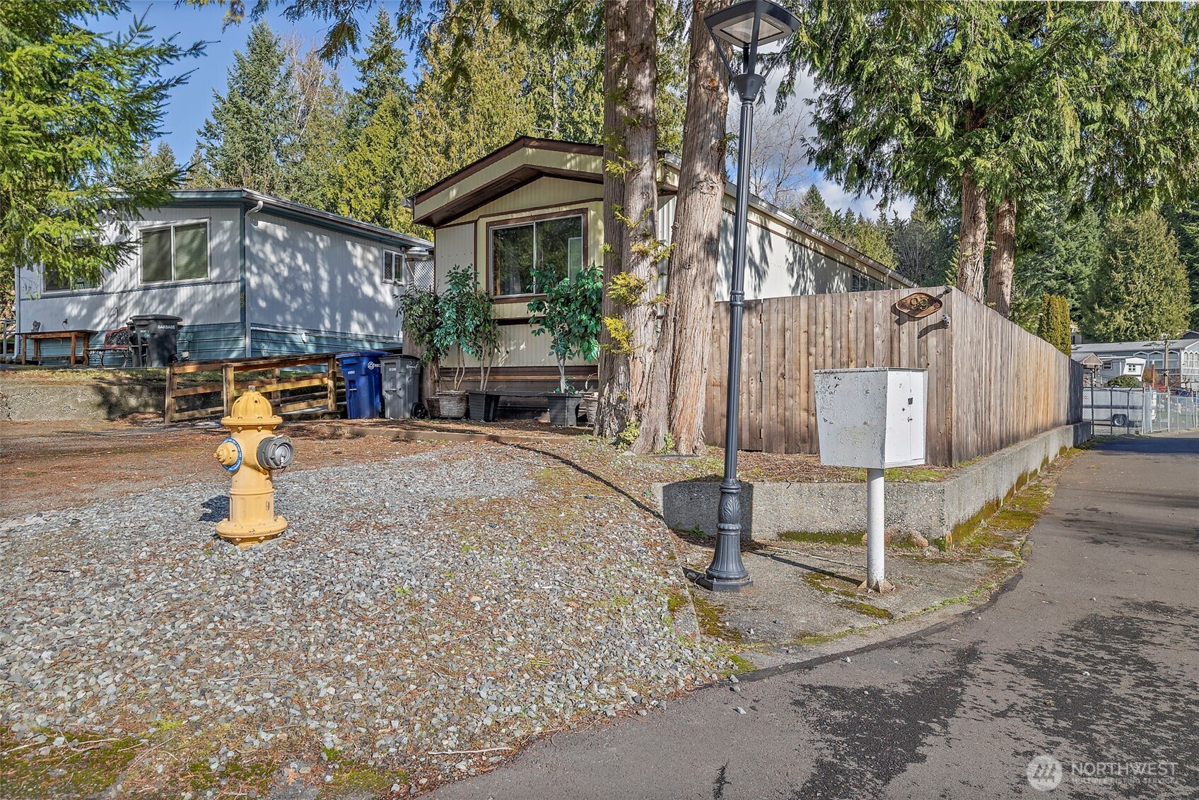 3333 228th Street Southeast, Unit 99 Bothell, WA 98021 - Photo 22 of 27 a view of a house with wooden fence