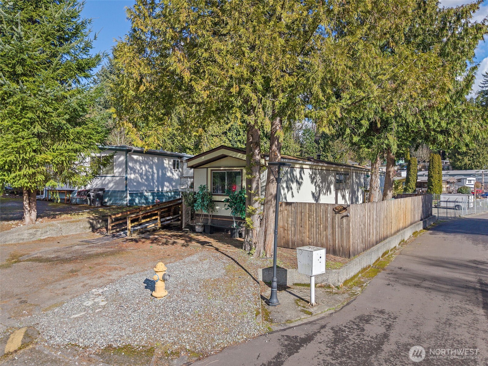 3333 228th Street Southeast, Unit 99 Bothell, WA 98021 - Photo 23 of 27 a view of a house with backyard and sitting area