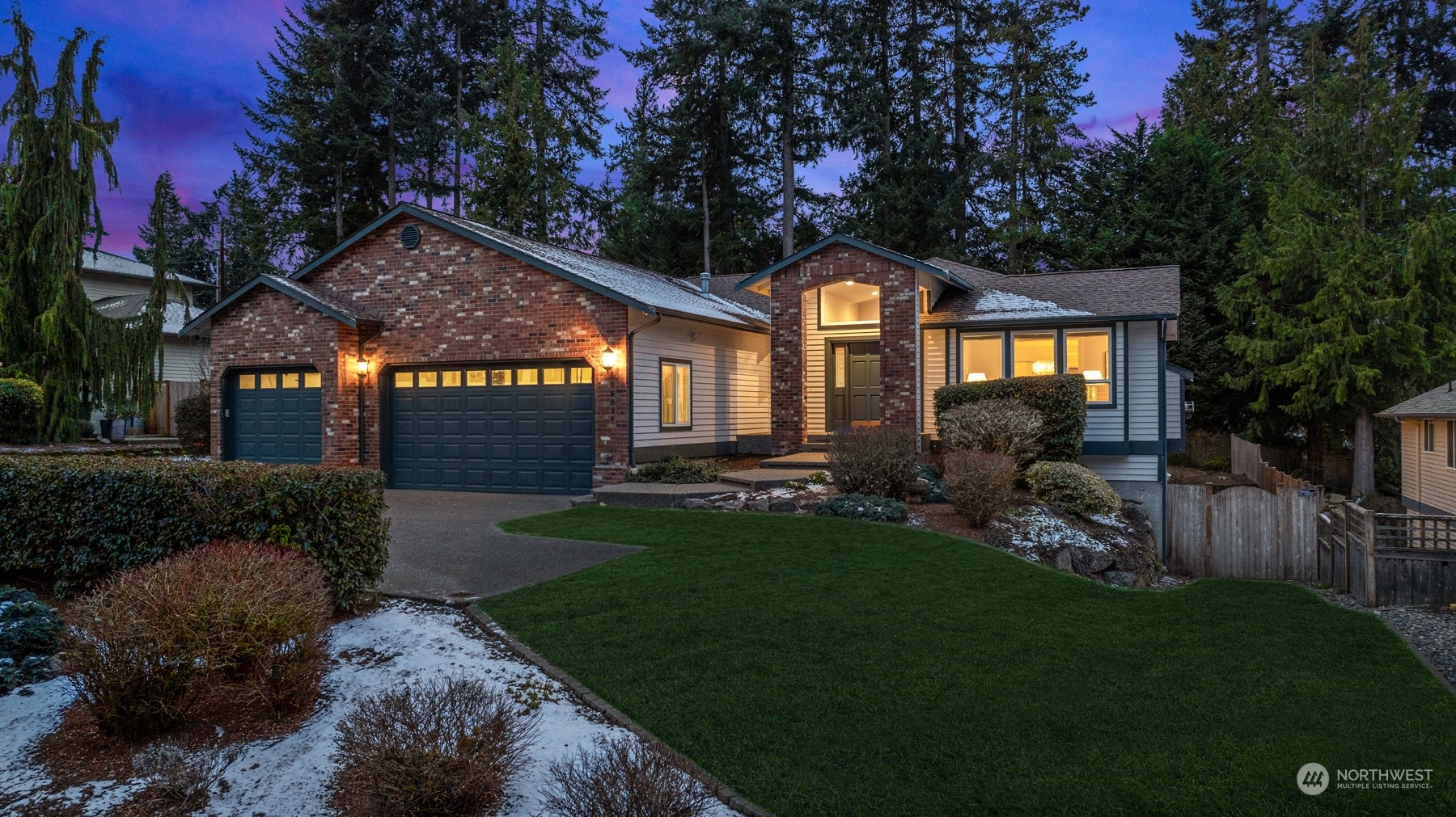 a front view of a house with a garden and pathway