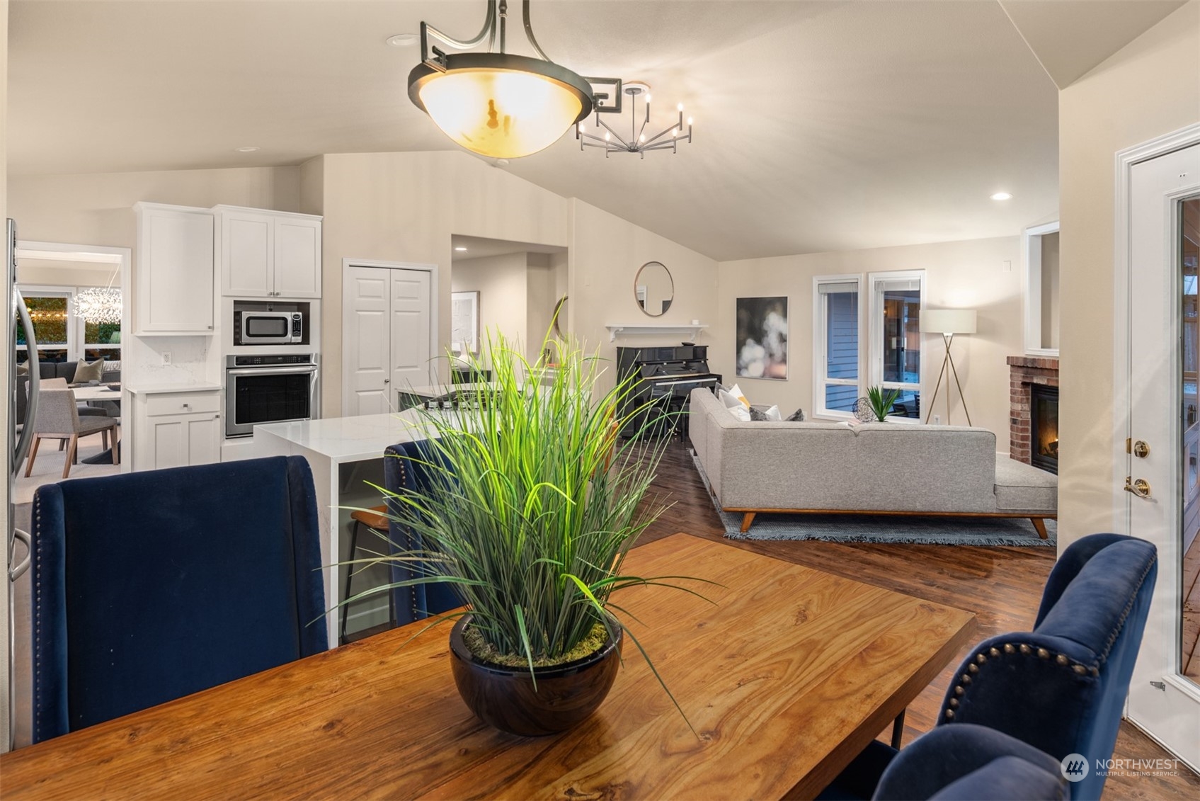 16034 68th Avenue West Edmonds, WA 98026 - Photo 11 of 32 a living room with furniture potted plant and kitchen view