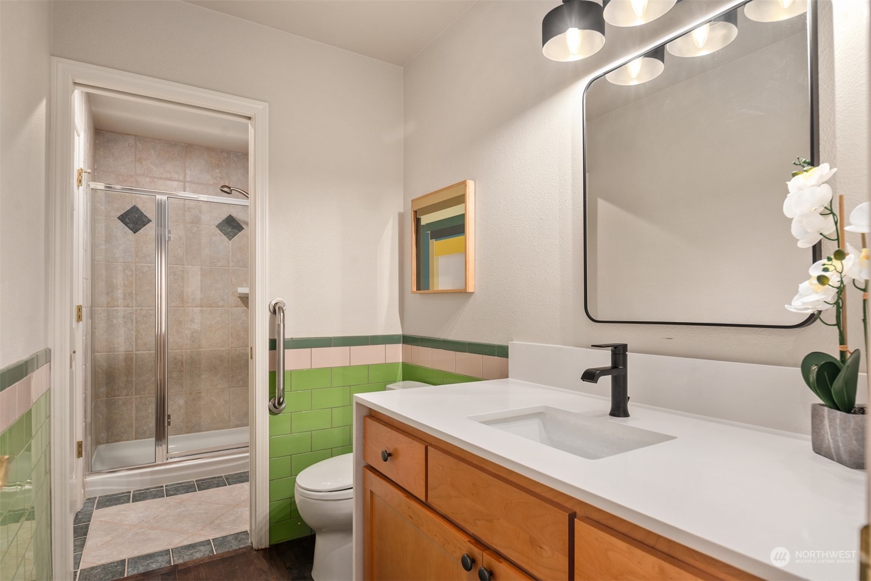 16034 68th Avenue West Edmonds, WA 98026 - Photo 19 of 32 a bathroom with a sink a toilet and shower