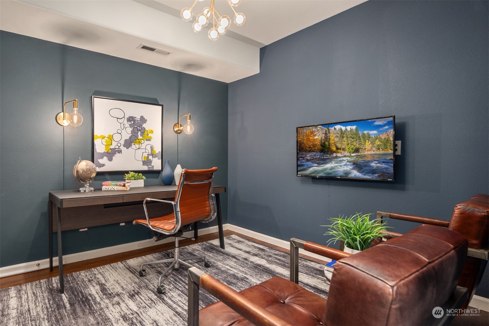 16034 68th Avenue West Edmonds, WA 98026 - Photo 21 of 32 a living room with furniture and a flat screen tv